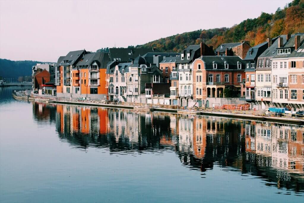 Picturesque town of Dinant, Belgium, along the Meuse River with a striking citadel and church.