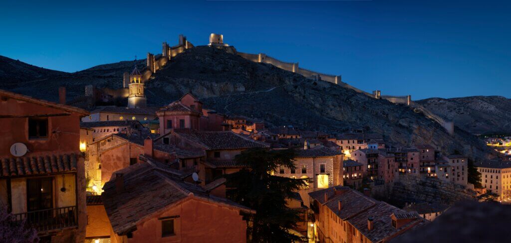 Scenic view of Albarracín, Spain – a medieval village with historic walls and red-hued houses.