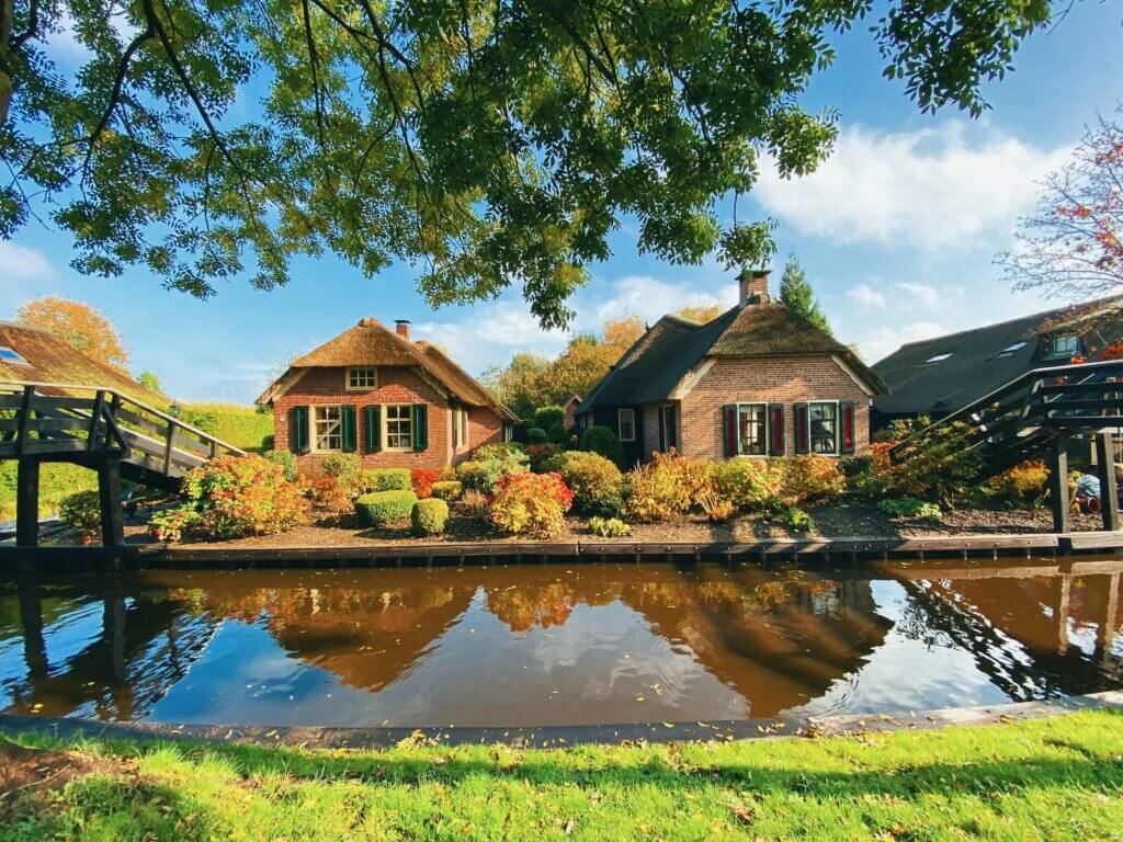 Fairytale village of Giethoorn, Netherlands, with peaceful canals and charming thatched-roof houses.