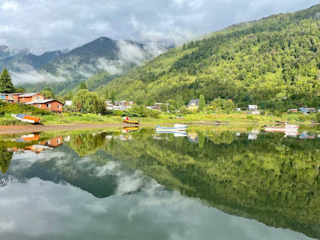 Remote campsite in Chile’s Aysén Region, with breathtaking views of turquoise glacial rivers and towering peaks.